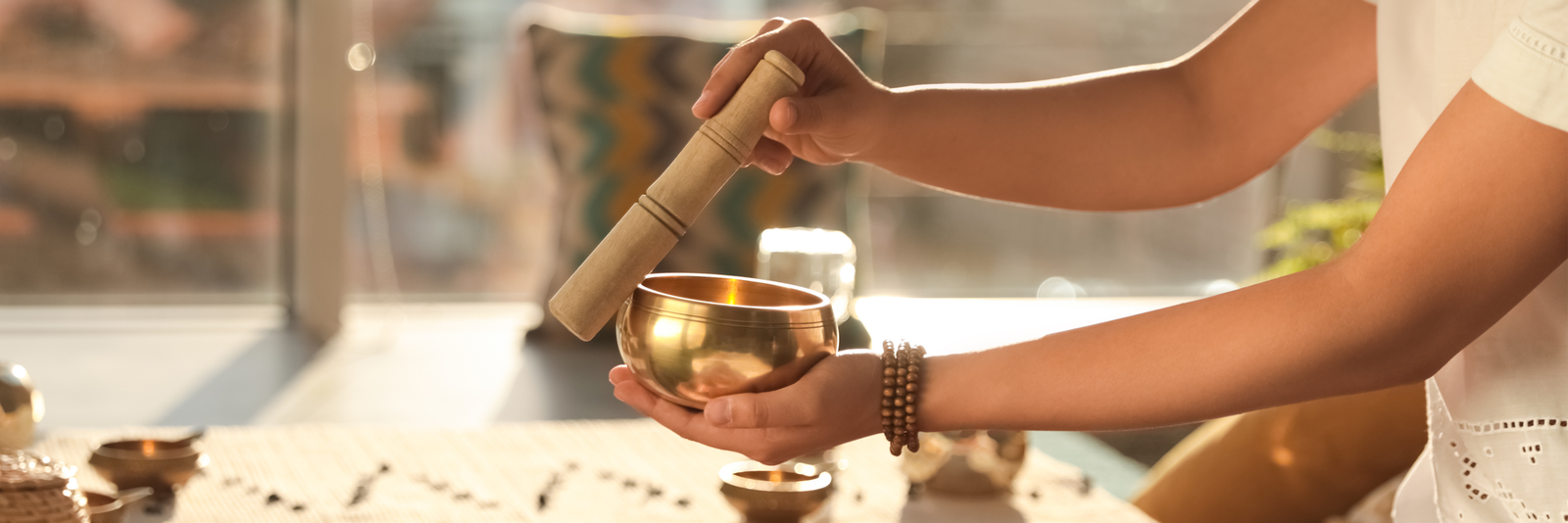 Tye Adekoya with singing bowls at Simply Reiki Houston