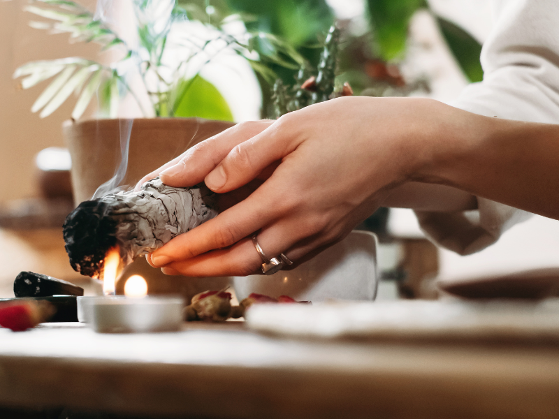 Smudging during a home energy cleansing in Houston